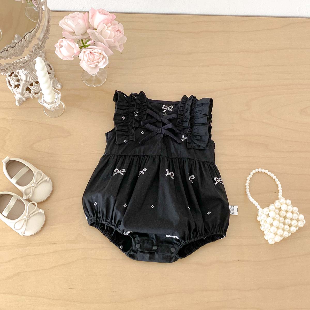 女の赤ちゃんブラックボウプリントロンパースノースリーブフリル - Baby Clothing Online のレビューと価格